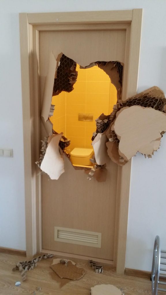 Handout photo of the bathroom door smashed by U.S. Bobsled team member Johnny Quinn when he became trapped inside